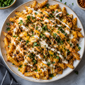 Loaded fries with cheese and spiced sauces